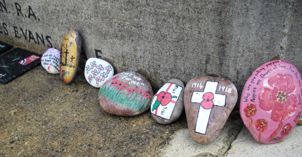 7 staones painted with various remembrance themes
