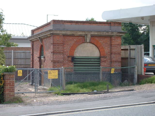 a smnall squat flat-foofed red brick building